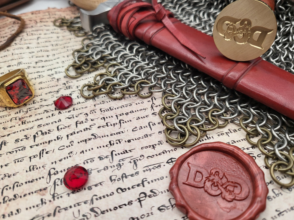 Dungeons & Dragons wax seal stamp displayed with red sealing wax and fantasy props.