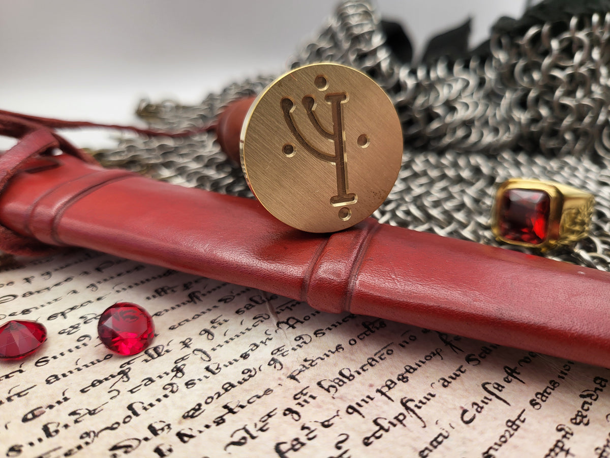 Gandalf rune wax seal stamp displayed with fantasy and Middle-earth inspired props.